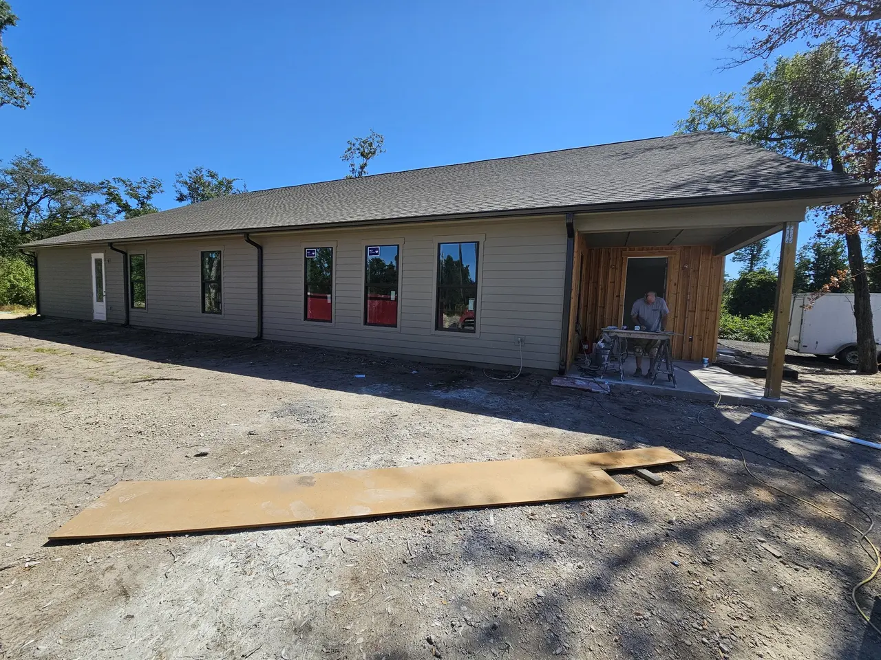 New commercial building with gutters and a covered entry