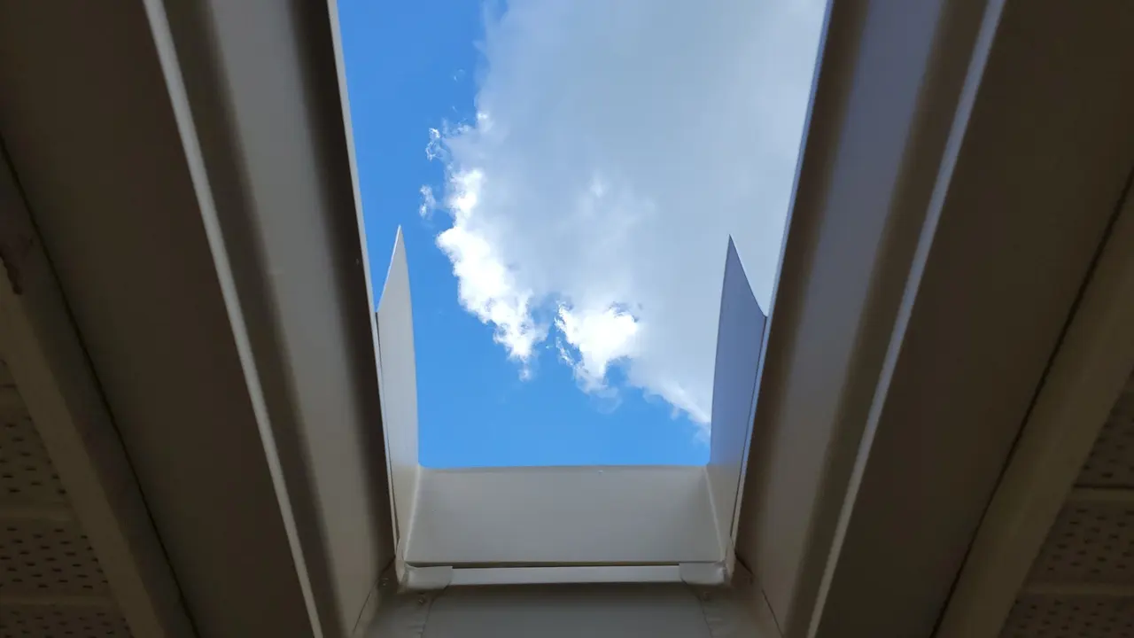 Looking up at a boxed soffit and new gutter