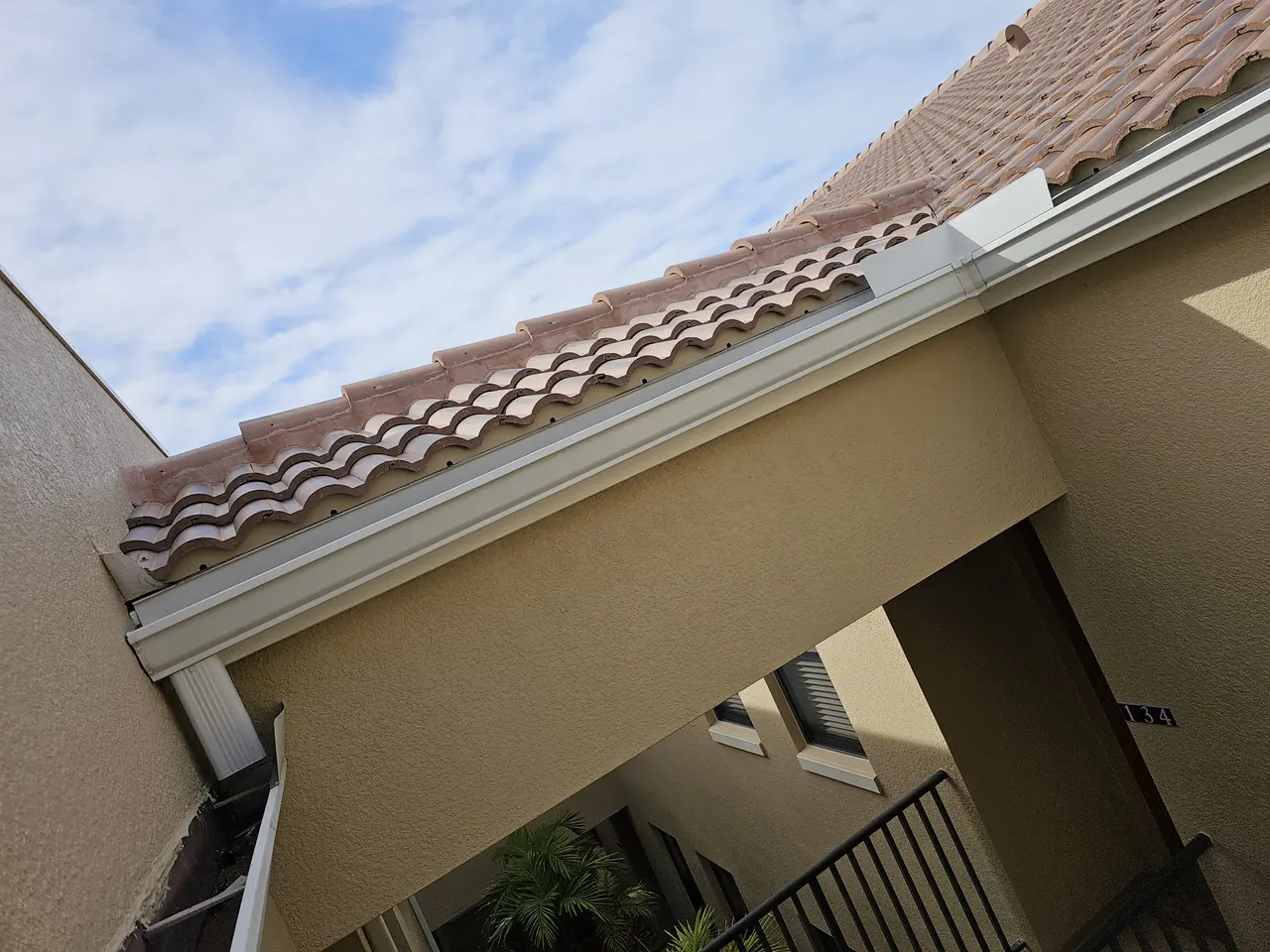 Gutter under a Spanish tile roof edge