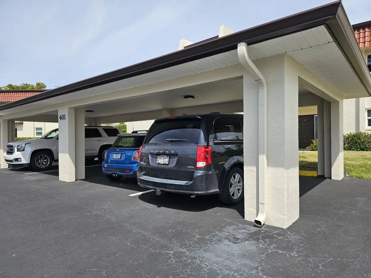 Carport with new gutter and downspout in a condo community