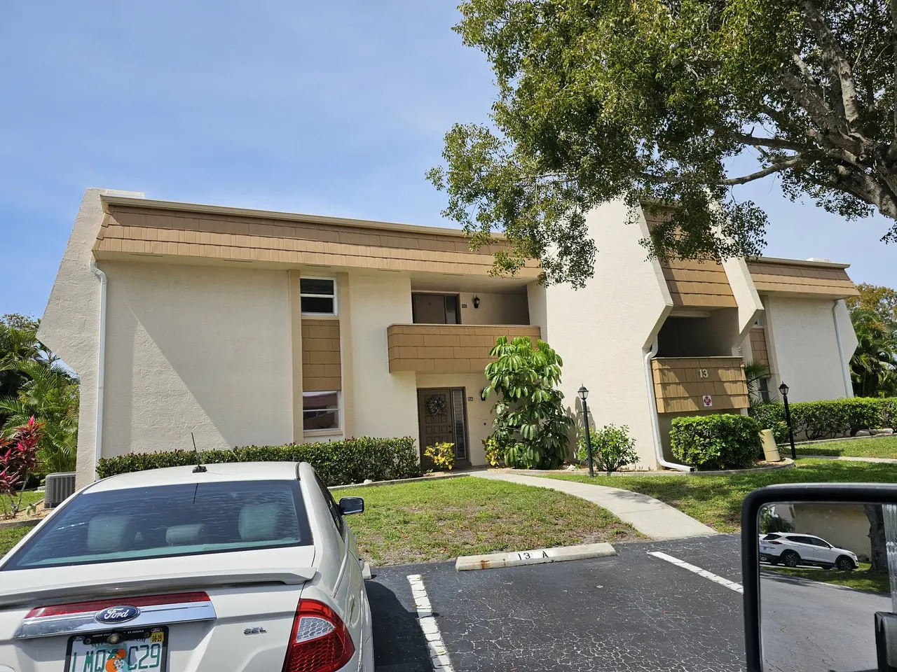 Two-story building with new white gutters along the lower roof edge